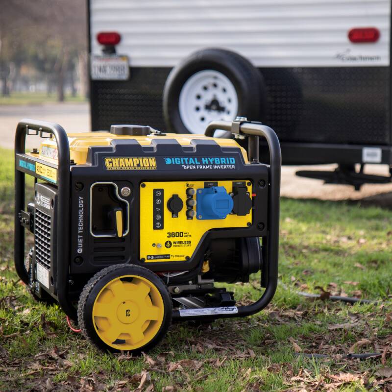 A Champion CPG4000DHY 3600 watt frame type petrol inverter generator in front of a motorhome