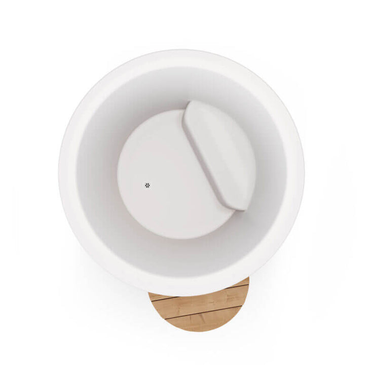 Top-down view of white interior cold tub showing internal bench and drain, with visible wooden step at the bottom, on a white background.