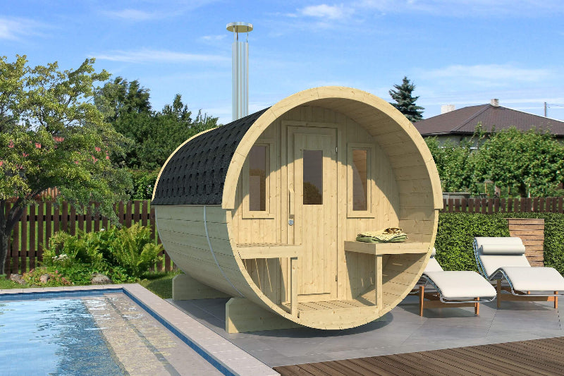 InMedias Barrel Sauna 250 installed beside a swimming pool, showcasing light wood with black shingle roof and two small benches, under a clear blue sky.