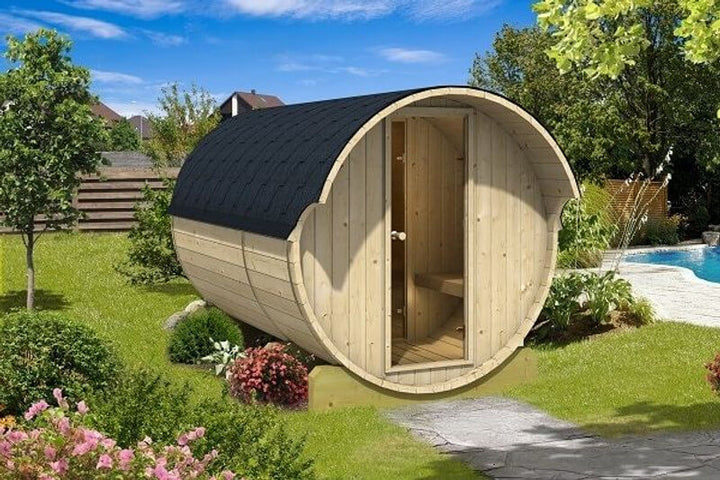 Rear view of InMedias Barrel Sauna 330 with open door revealing the wooden interior — on a garden background.