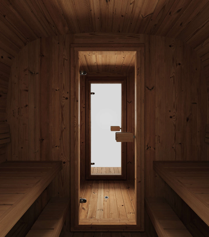 InMedias Sauna Icon 385XL interior shot showing wood-panel seating and door view to entry room , on a light gray background.