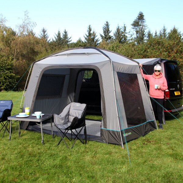 Outdoor Revolution Cayman Cuda FG Driveaway Awning shown with a woman standing