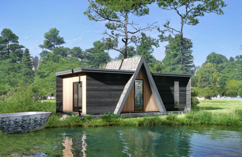Side view of a dark A-frame glamping cabin with natural wood entrance, set beside a pond with boat and forested background.