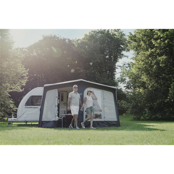 A Riviera Air 390 Elements Proshield shown from the front with a couple standing in front