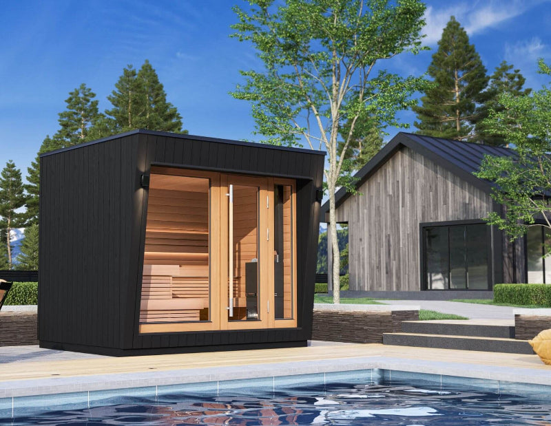 Saunum AirCube Space outdoor sauna installed beside a pool, featuring modern black exterior and large front-facing glass doors and windows.