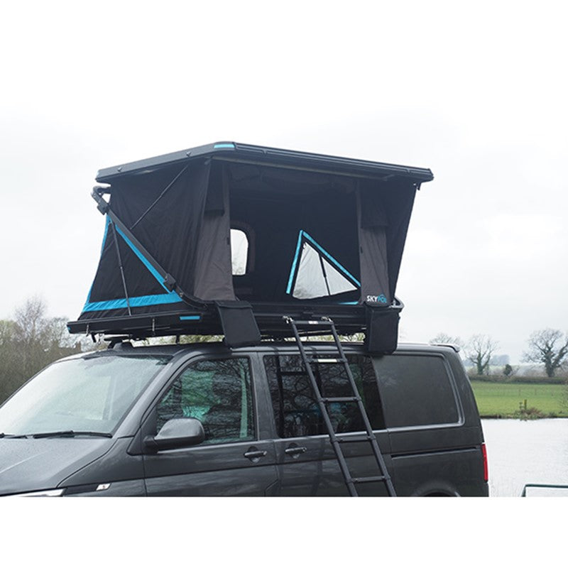 Skypod rooftop tent mounted on a vehicle roof with ladder access and black and blue fabric design.