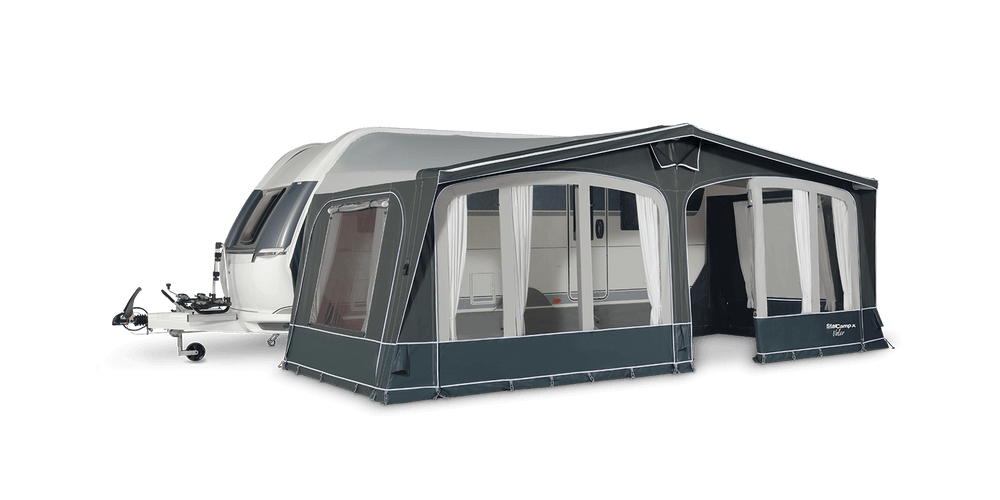 Starcamp Valor Air awning attached to a touring caravan, displayed with all window panels open and curtains tied back, revealing the spacious interior, with a transparent background.