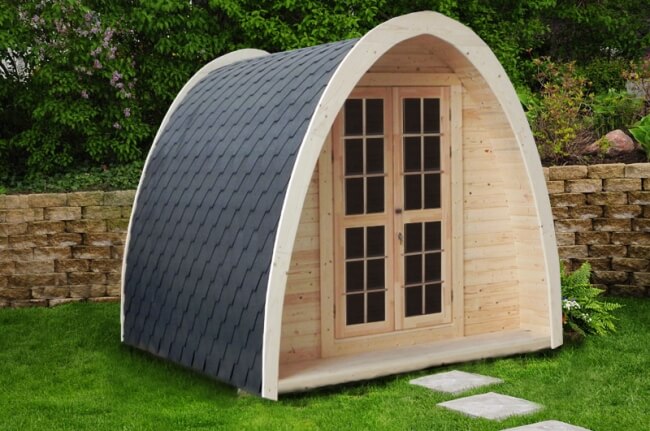 Front view of the Viking Industrier 2.4 x 4m Camping Pod with terrace in a garden setting.