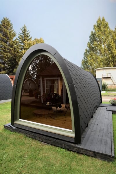 Rear exterior view of the Viking Industrier 2.4 x 5.9m Camping Pod with large arched glass wall on a grassy outdoor background.