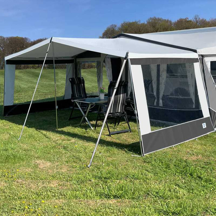 A Walker Castel Sun Canopy with side panels in a field