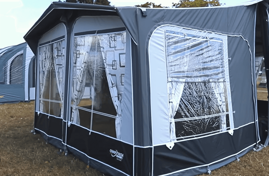 Camptech Duchess porch awning side view with large clear windows and patterned curtains, ideal for family camping comfort.