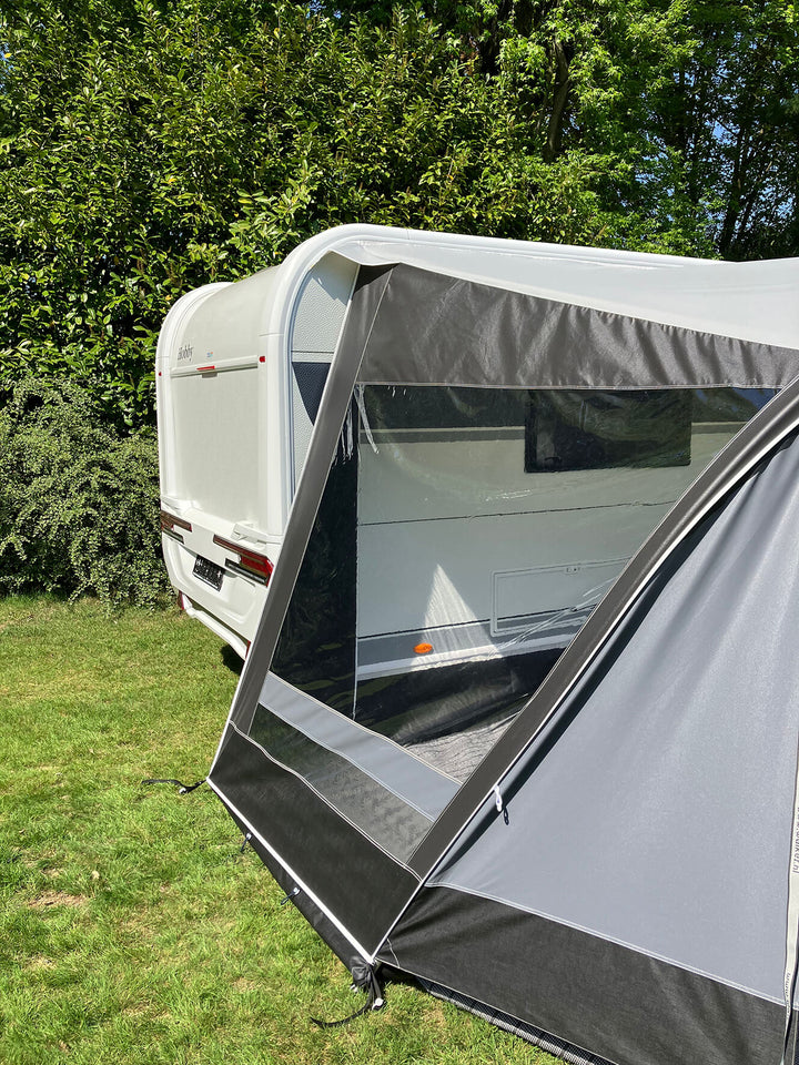 Rear view of Walker Combi-Luxe awning attached to caravan, highlighting window and canopy structure.