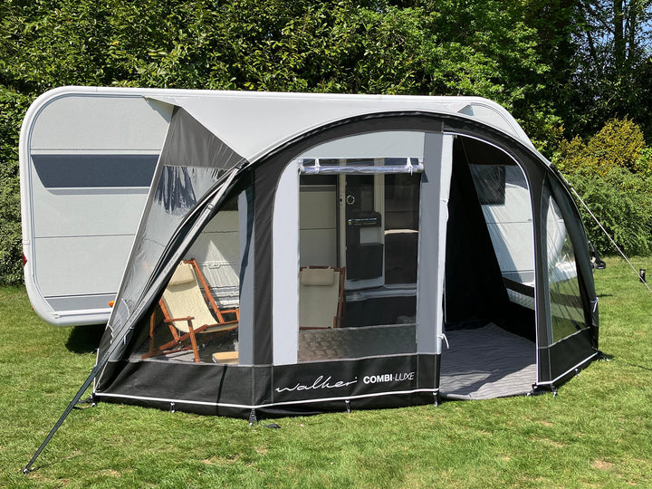 Angled front view of Walker Combi-Luxe awning with partial opening, showing entrance and seating area.