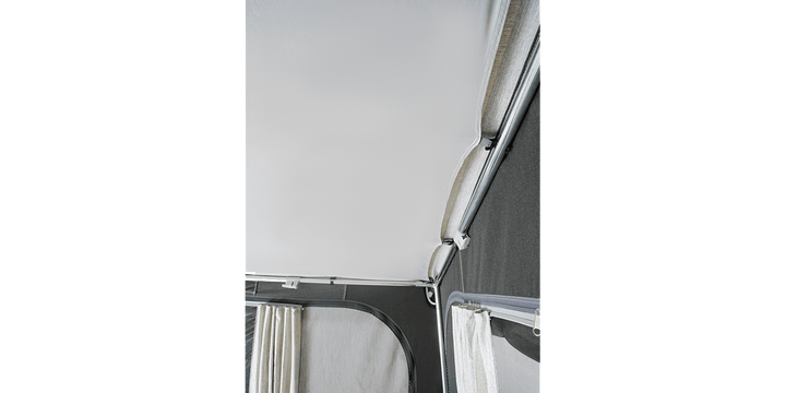 Dorema Quartz 400 De Luxe poled awning on a transparent background, displayed with open front panels and curtains to show the spacious interior.