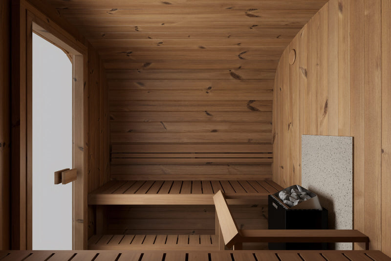 Interior of InMedias Sauna Icon 220XL showing bench seating and a Harvia heater .