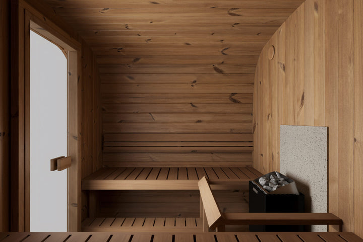 Interior of InMedias Sauna Icon 220XL showing bench seating and a Harvia heater .