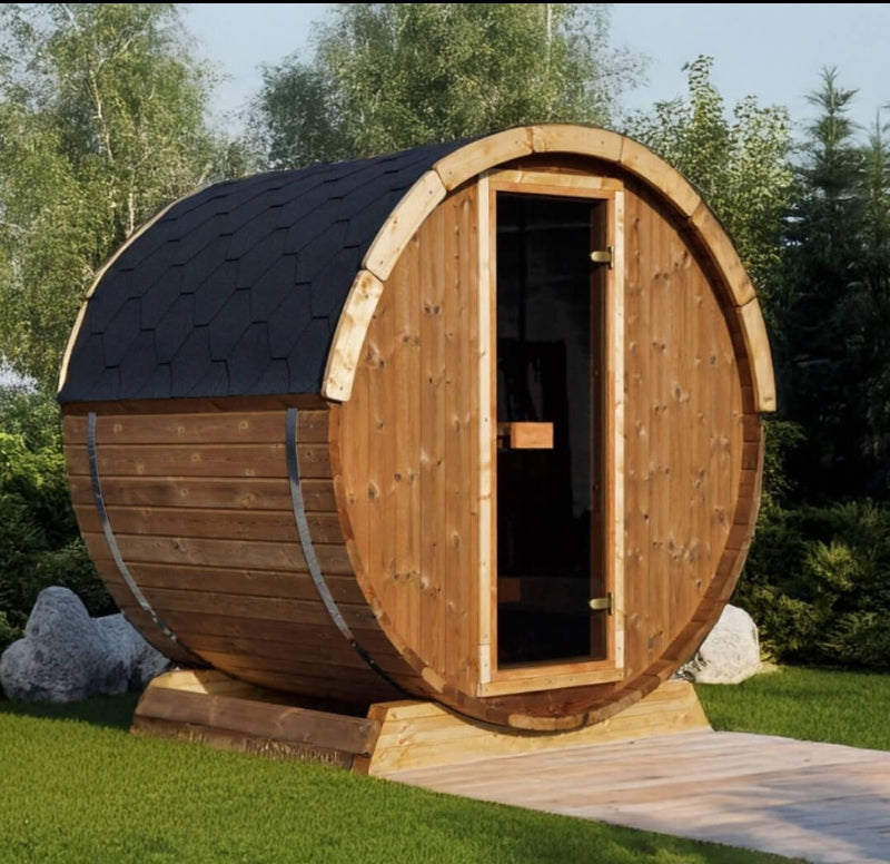 InMedias Terrace Sauna with shingle roof and medium brown wood siding placed outdoors with bushes and trees behind.