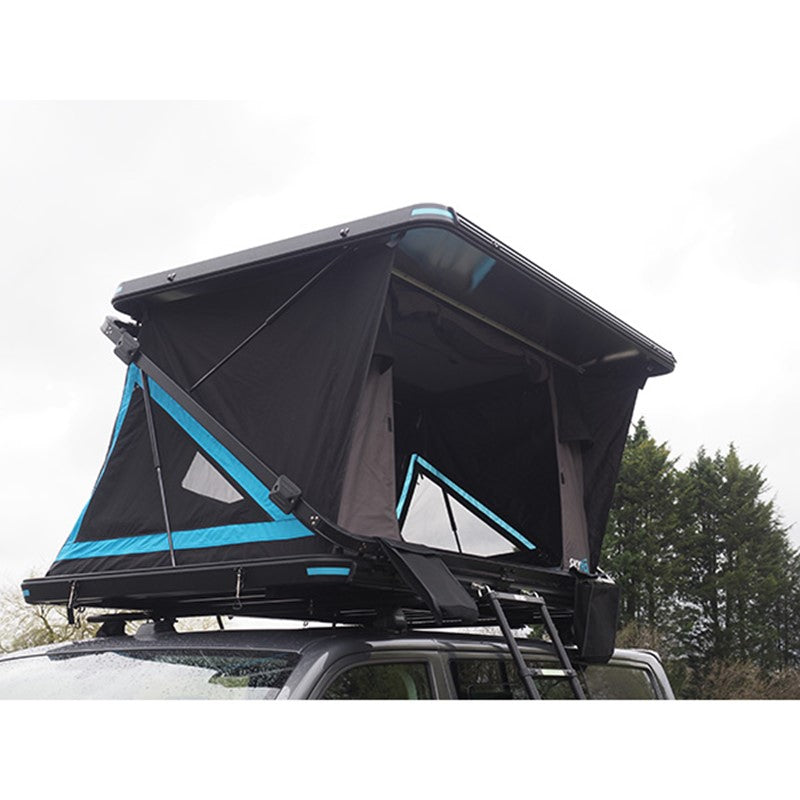 Skypod rooftop tent opened on a dark grey campervan ready for camping near a lake.