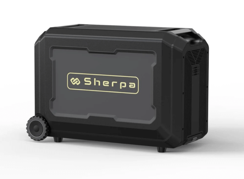 A black Sherpa BASE 5.0 Extra Battery viewed from the front side, showing a sleek casing with bold Sherpa branding and rugged wheels for portability, on a white background.
