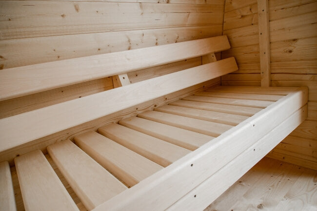 Interior bench detail of Viking Industrier Sauna Pod 2.4 x 2.3m with smooth wooden slats.