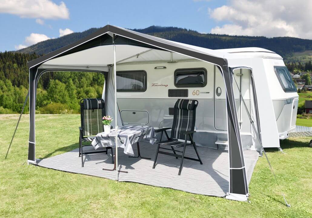 Open front view of Walker Touring-Plus awning on Eriba caravan, with table and chairs inside.