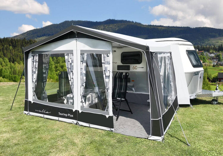 Walker Touring-Plus full awning setup on an Eriba Touring caravan in a scenic mountain campsite.