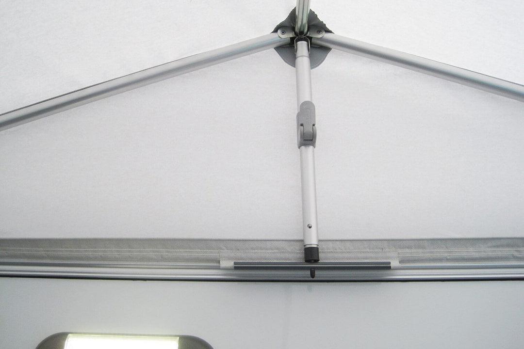 Close-up of the Walker Trigano Silver awning frame tension pole showing its secure clamping mechanism under the roof panel.