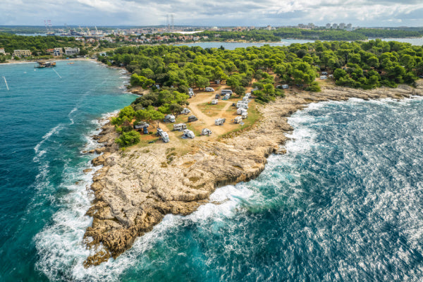 Caravans camping in windy weather by the sea