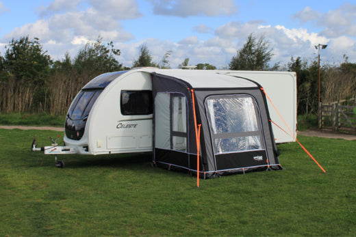 A small Camptech awning on a caravan in a field