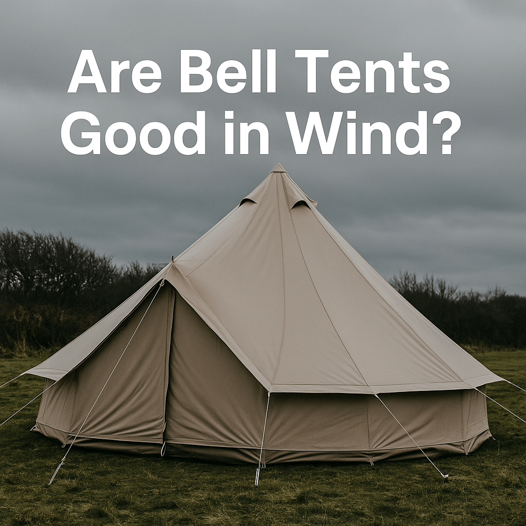 Beige bell tent pitched on a grassy field under grey skies with the text “Are Bell Tents Good in Wind?”