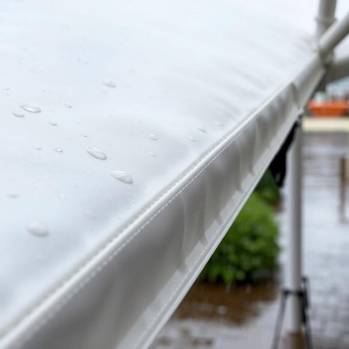 Close up of an awning with rainwater on it
