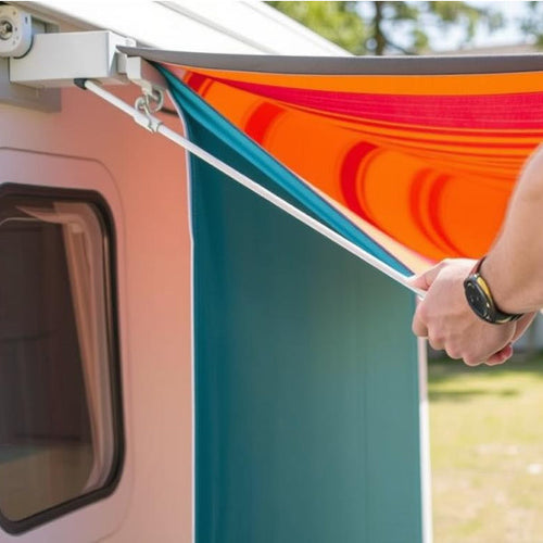 A pair of hands using a crank on a caravan awning