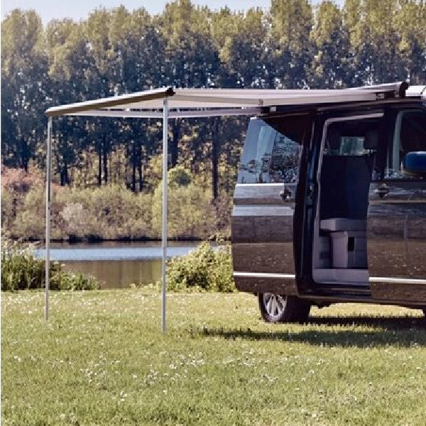 A Thule Omnistor 4900 awning connected to a van