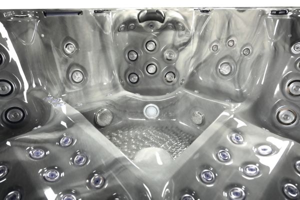 Luso Spas The Hercules Hot Tub grey interior view highlighting central foot massage area and jets.