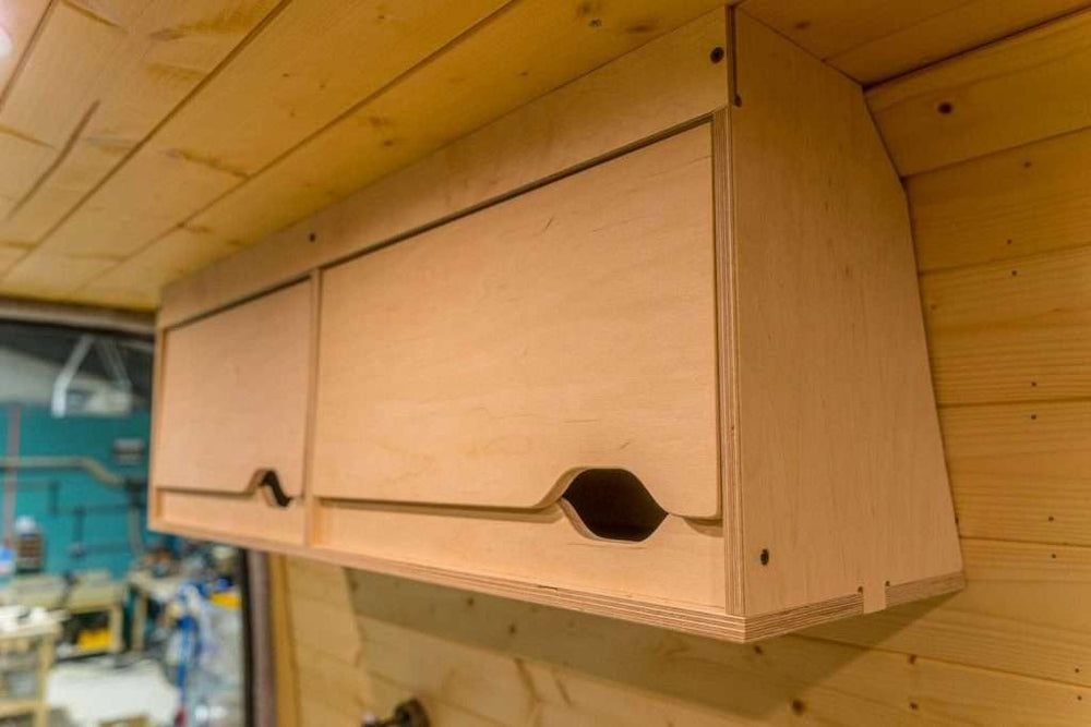 Installed view of the Campervan Cornice Top Cabinets mounted inside a campervan with a natural wood interior background.