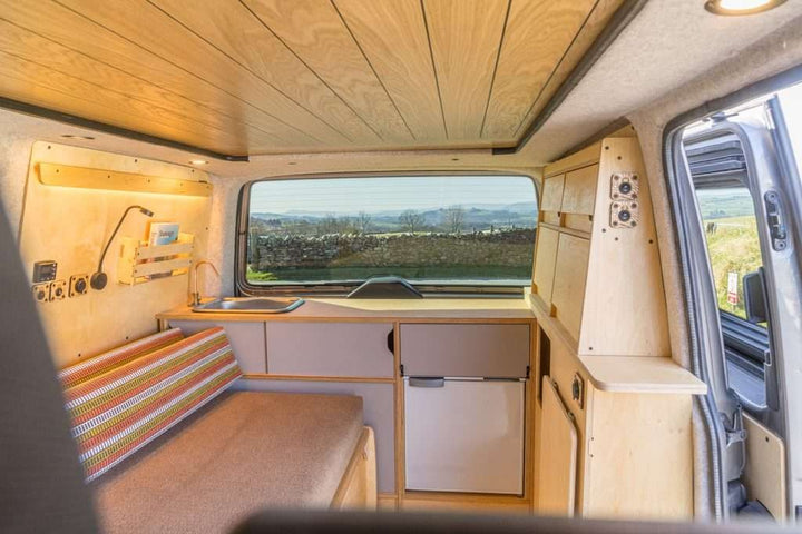 Campervan Ranger Kitchen Unit complete interior view with bench seat, fridge, sink and side shelving unit.