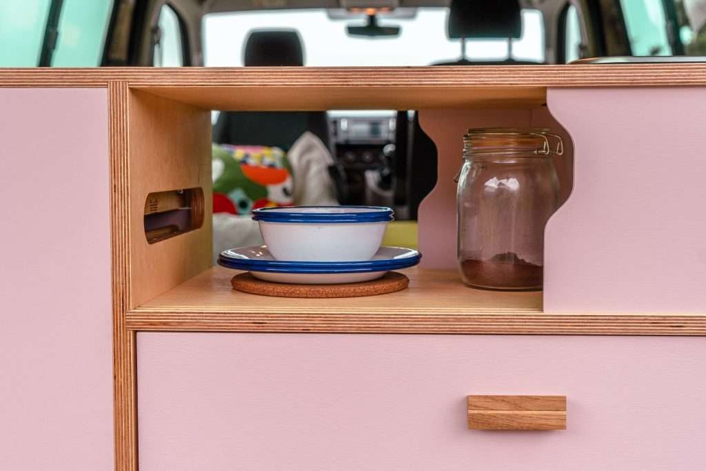 Campervan Ranger Kitchen Unit drawer and cupboard storage detail with soft pink cabinet front and oak handle.