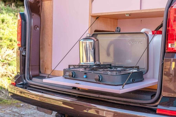 Campervan Ranger Kitchen Unit pull out rear hob setup with portable gas stove and kettle ready for cooking.