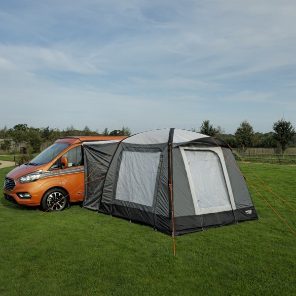 Camptech Moto Crown Awning shown in a field from mid distance