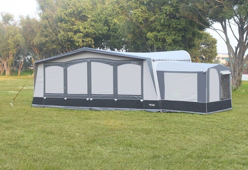 Camptech Tall Annex for Poled Awnings in grey and black on a grassy field.