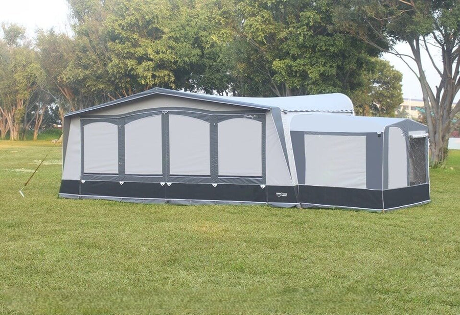 Camptech Tall Annex for Poled Awnings in grey and black on a grassy field.