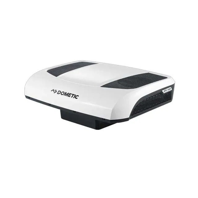 Dometic CoolAir RTX 1000 12V rooftop air conditioner angled rear view with white aerodynamic housing and black ventilation grilles on a white background.