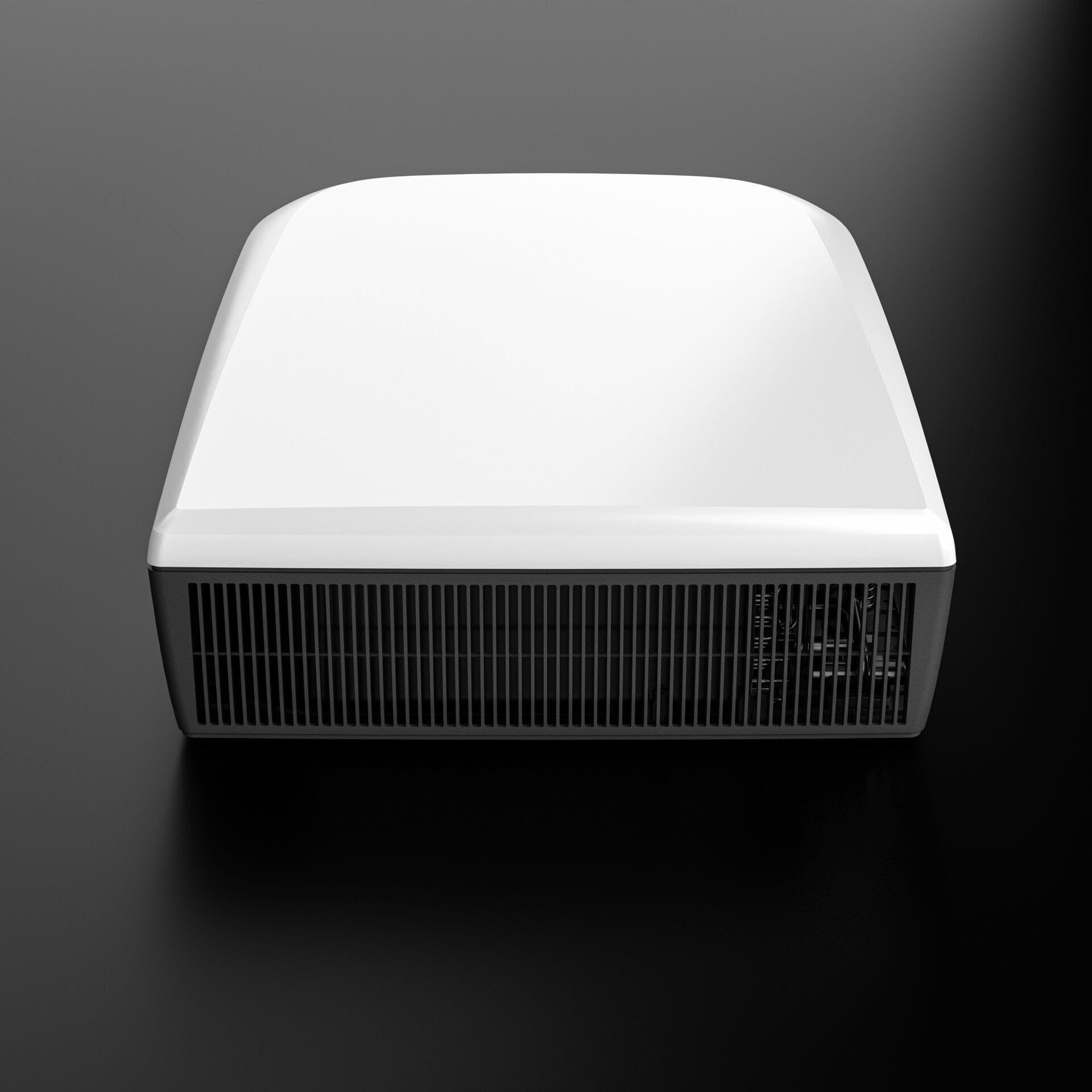 Dometic FJZ7 3000 white campervan roof air conditioner front view showing grille and housing, on ablack background.