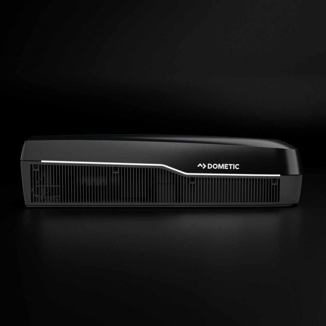 Dometic FJZ7 3500 white campervan roof air conditioner side profile with vent grille detail, on a black background.
