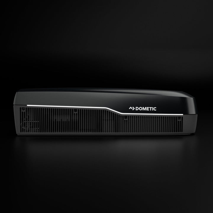 Dometic FJZ7 3500 white campervan roof air conditioner side profile with vent grille detail, on a black background.