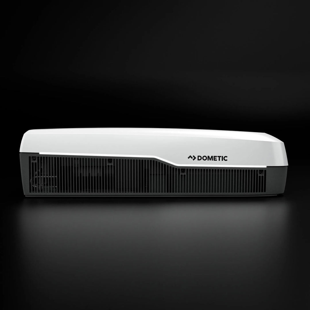 Dometic FJZ7 3500 white campervan roof air conditioner side profile with vent grille detail, on a black background.