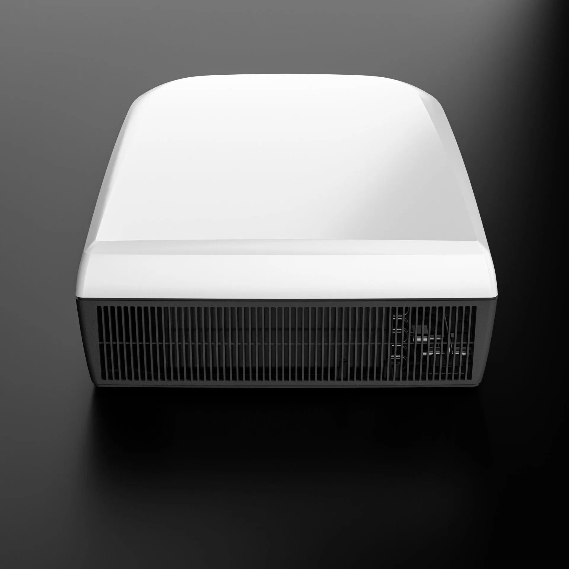 Dometic FJZ7 3500 white campervan roof air conditioner front view with vent grille detail, on a black background.