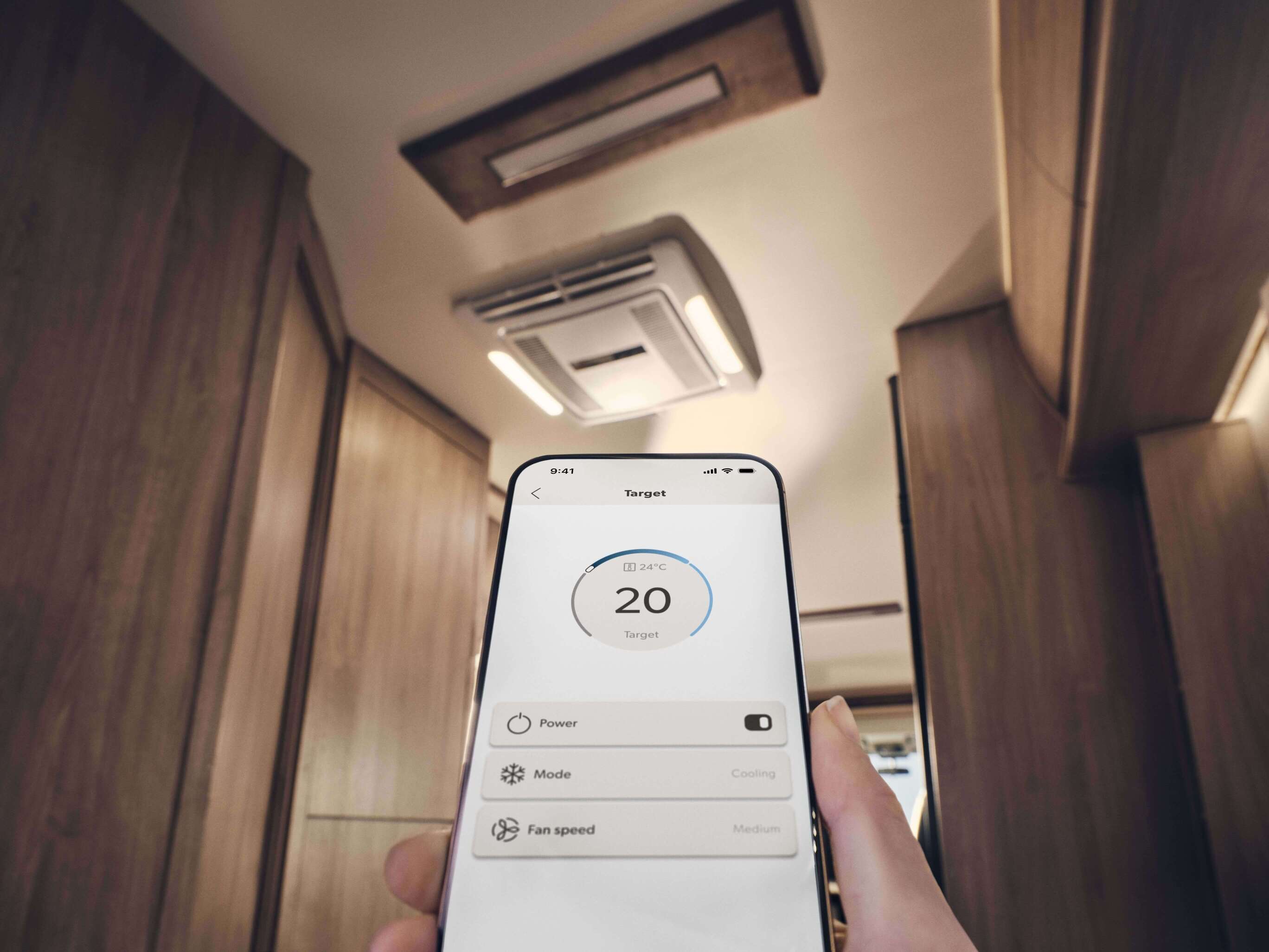 Dometic FJZ7 2200 air conditioning unit installed in campervan living space with ceiling vents.