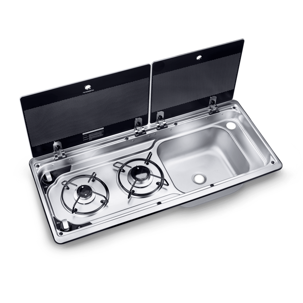 Partial open view of the Dometic MO 9722R 2-Burner Hob & Sink Combination with one glass lid lifted to reveal the burners while the sink remains covered, on a transparent background.