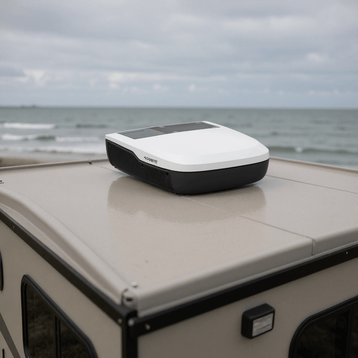 Dometic FreshJet FJX7 2200 rooftop air conditioner mounted on a camper by the seaside under cloudy skies.